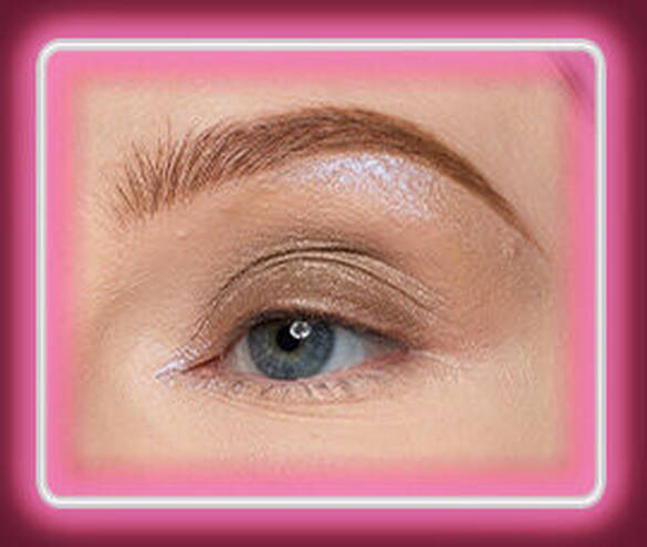 Close-up of an eye with NYX Professional Makeup Lid Lingerie Cream Eye Pigment in 07 Granite Grind applied across the eyelid.