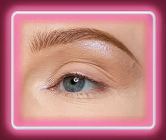 Close-up of an eye with NYX Professional Makeup Lid Lingerie Cream Eye Pigment in 10 Lacy Lilac applied to the inner corner and brow bone.