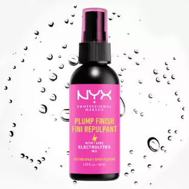 A bottle of NYX Professional Makeup Plump Finish Setting Spray with electrolytes, against a background of water droplets.