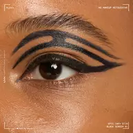 Close of a model wearing Epic Inky Stix on the top of their eyelid as a winged liner style in shade 01 Black Screen