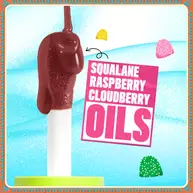 Features a stylized visual of a large, brown, chocolate-like drip descending from an applicator, set against a light blue background. Text highlights key ingredients: "SQUALANE," "RASPBERRY," and "CLOUDBERRY OILS."